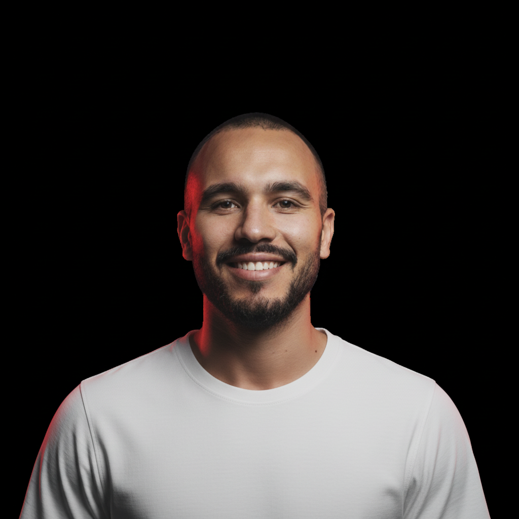 Keep the same person exactly as in the original image, same face, skin tone, beard, hairstyle and lighting.
Keep the same pose, same expression and camera angle.
Replace the current shirt with a plain white t-shirt with realistic fabric texture.
No logos, no text on the shirt.
High realism portrait photography, high resolution, clean background, natural shadows.
Ultra realistic skin details, 8K, HD, photorealistic style.